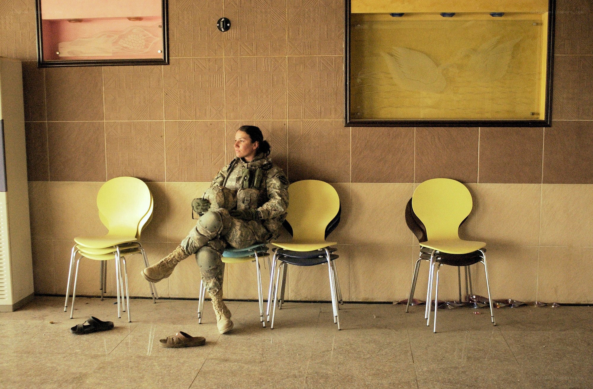 Soldier resting in a waiting area