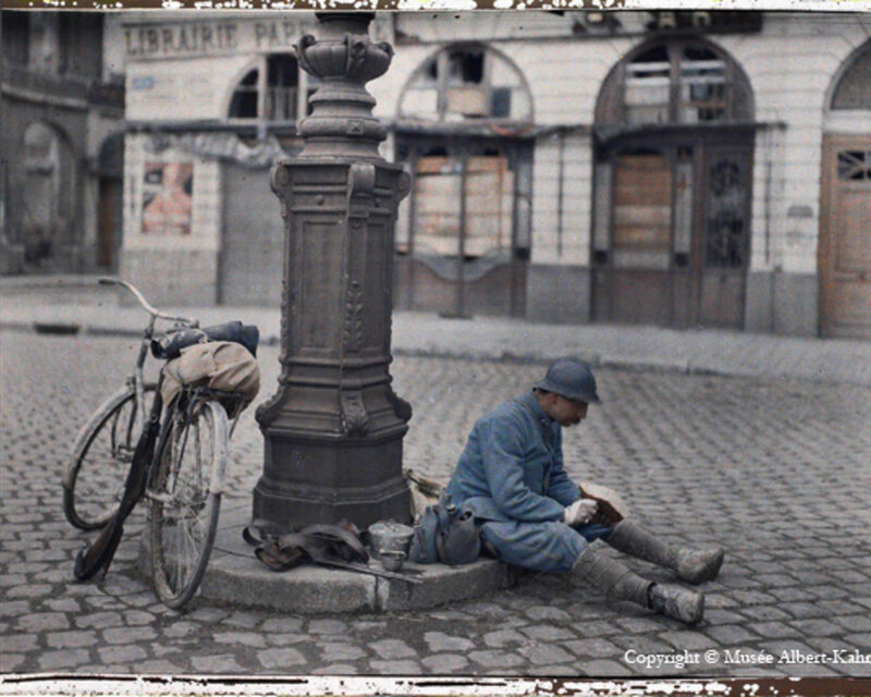 Soldier Resting on Street