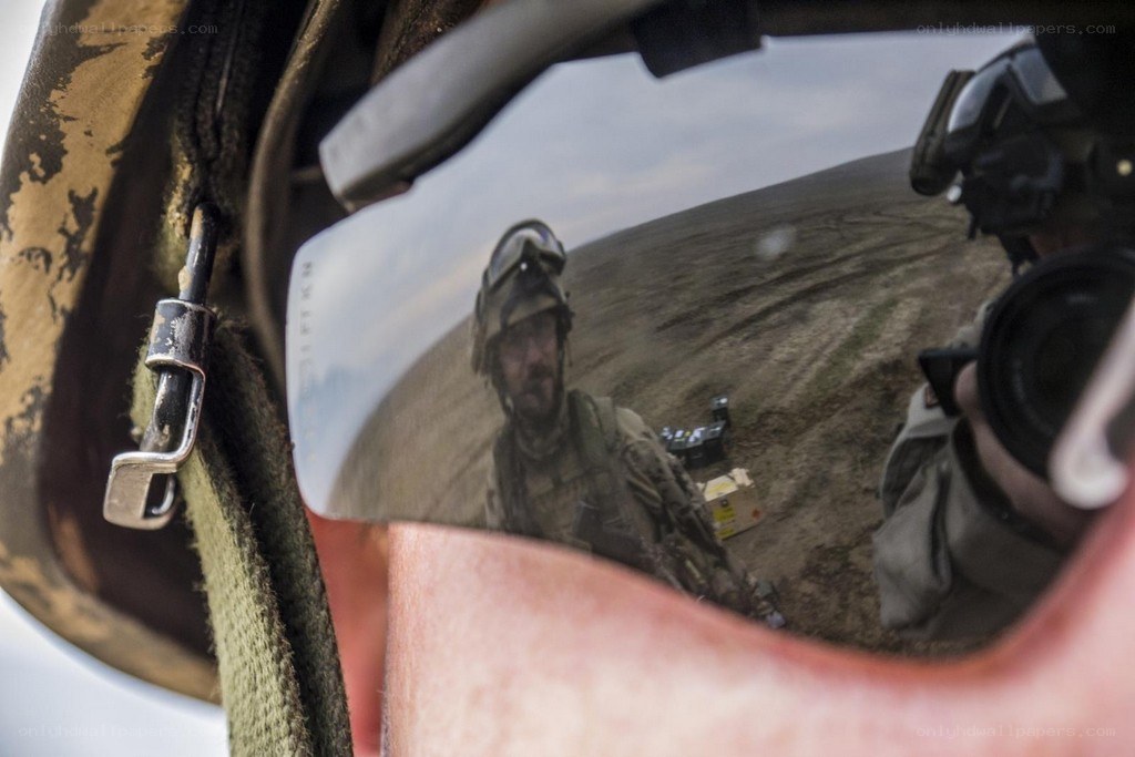Soldier's reflection in helmet visor
