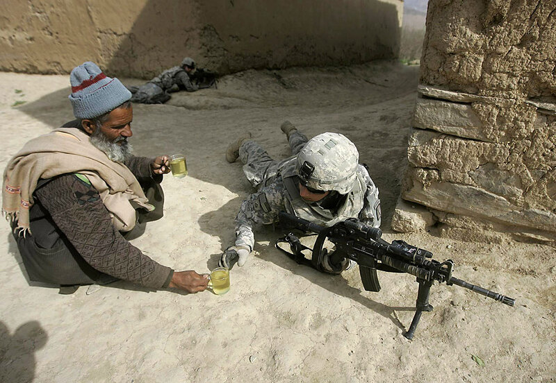 Soldier shares tea with local man