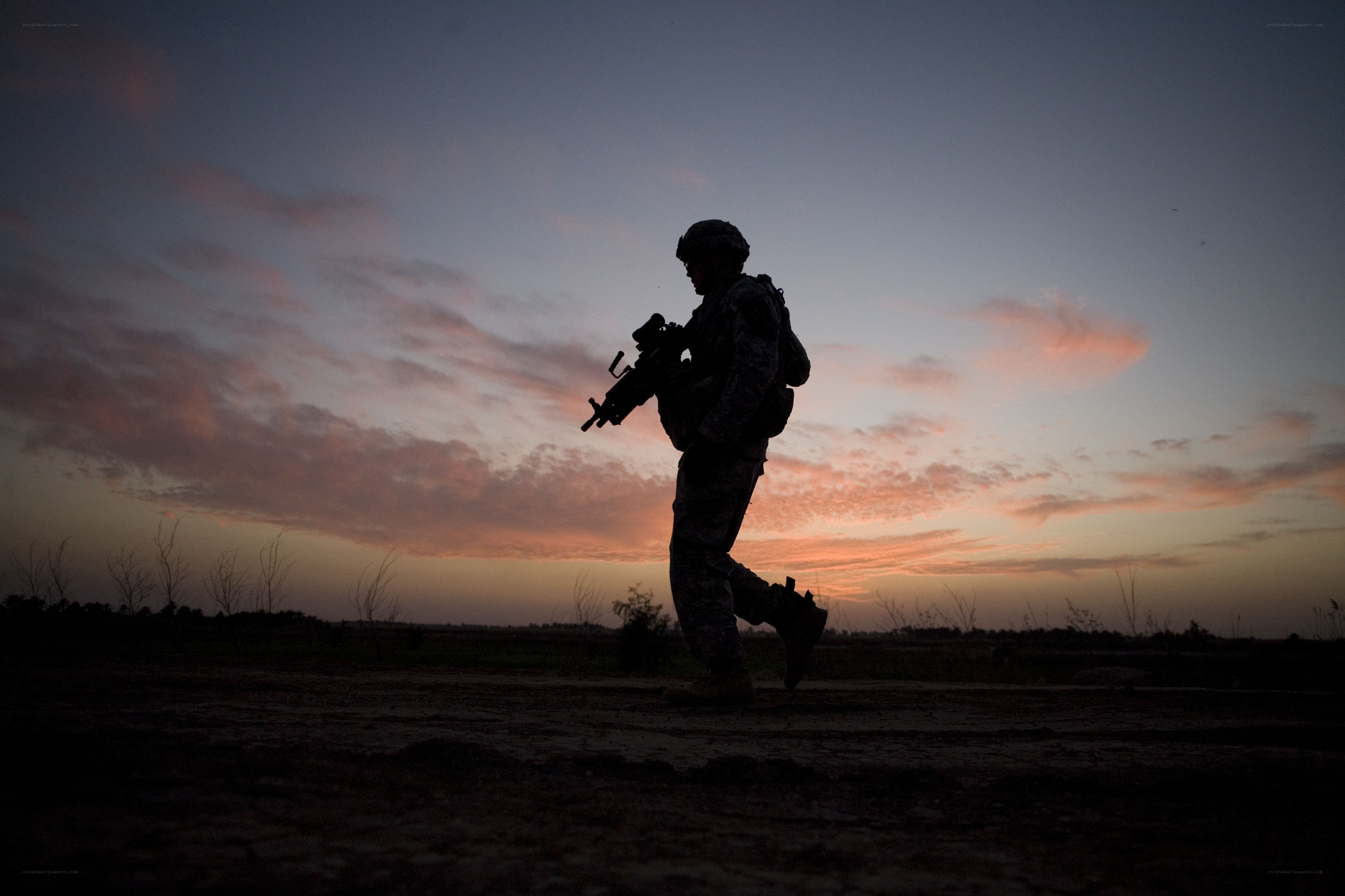 Soldier silhouetted at dusk
