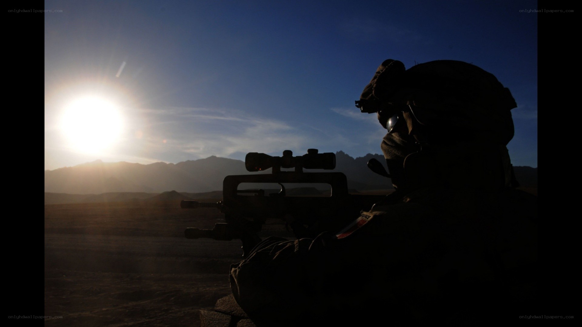 Soldier silhouetted at sunrise
