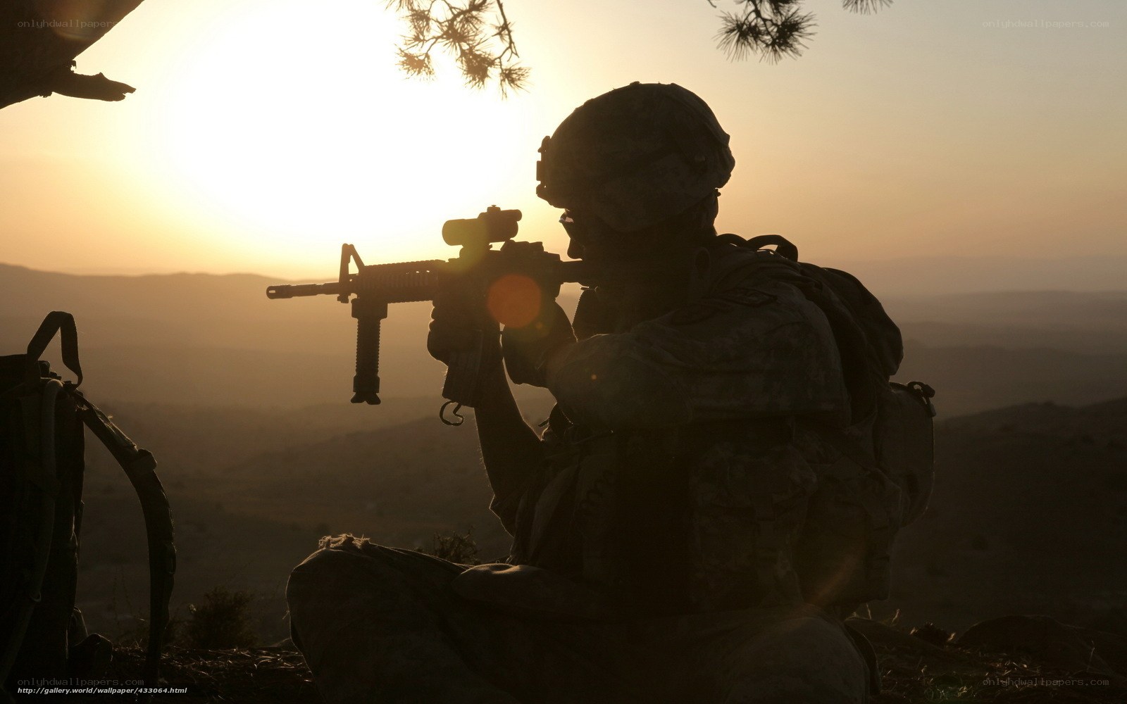 Soldier silhouetted at sunset