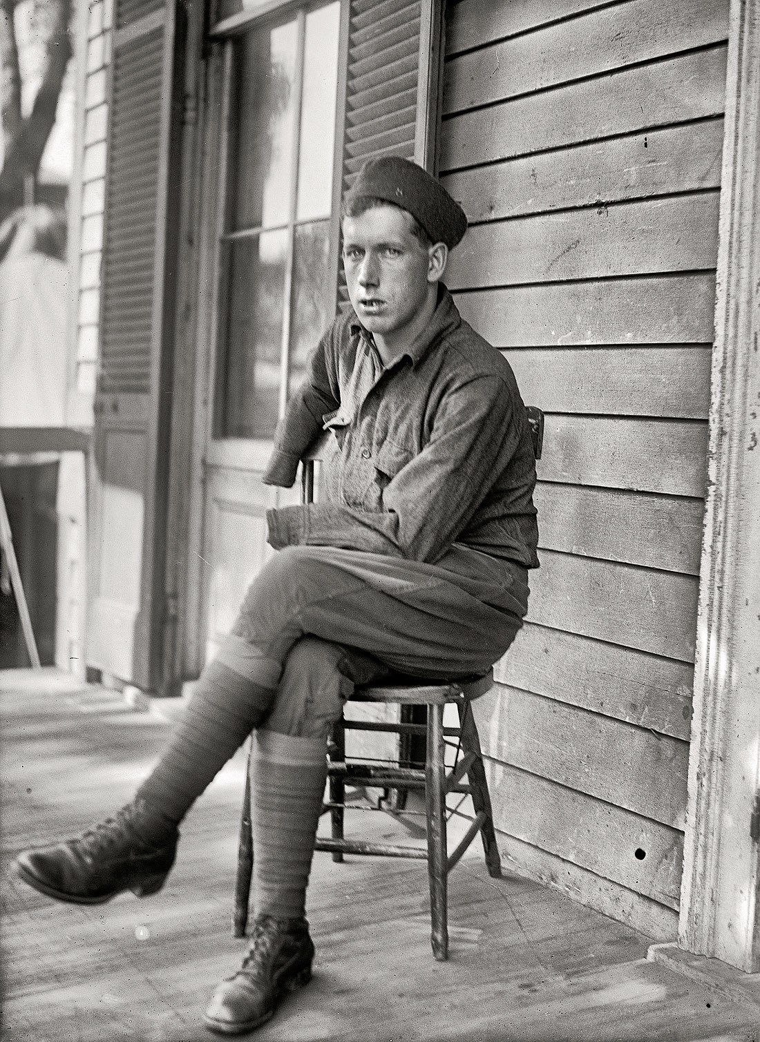 Soldier sitting on porch