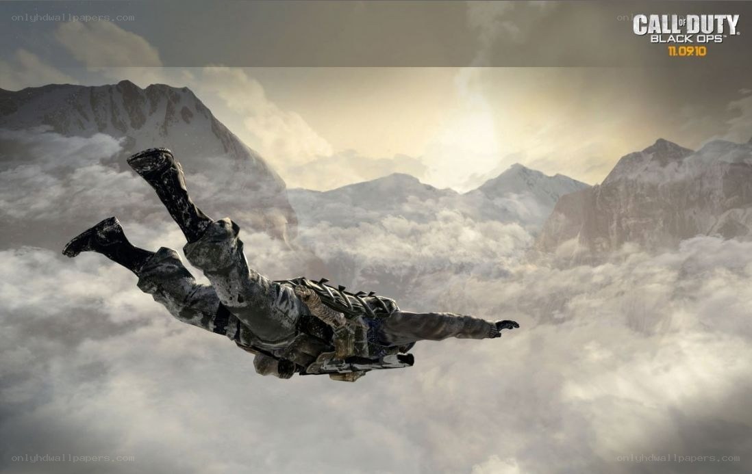 Soldier skydiving over mountains
