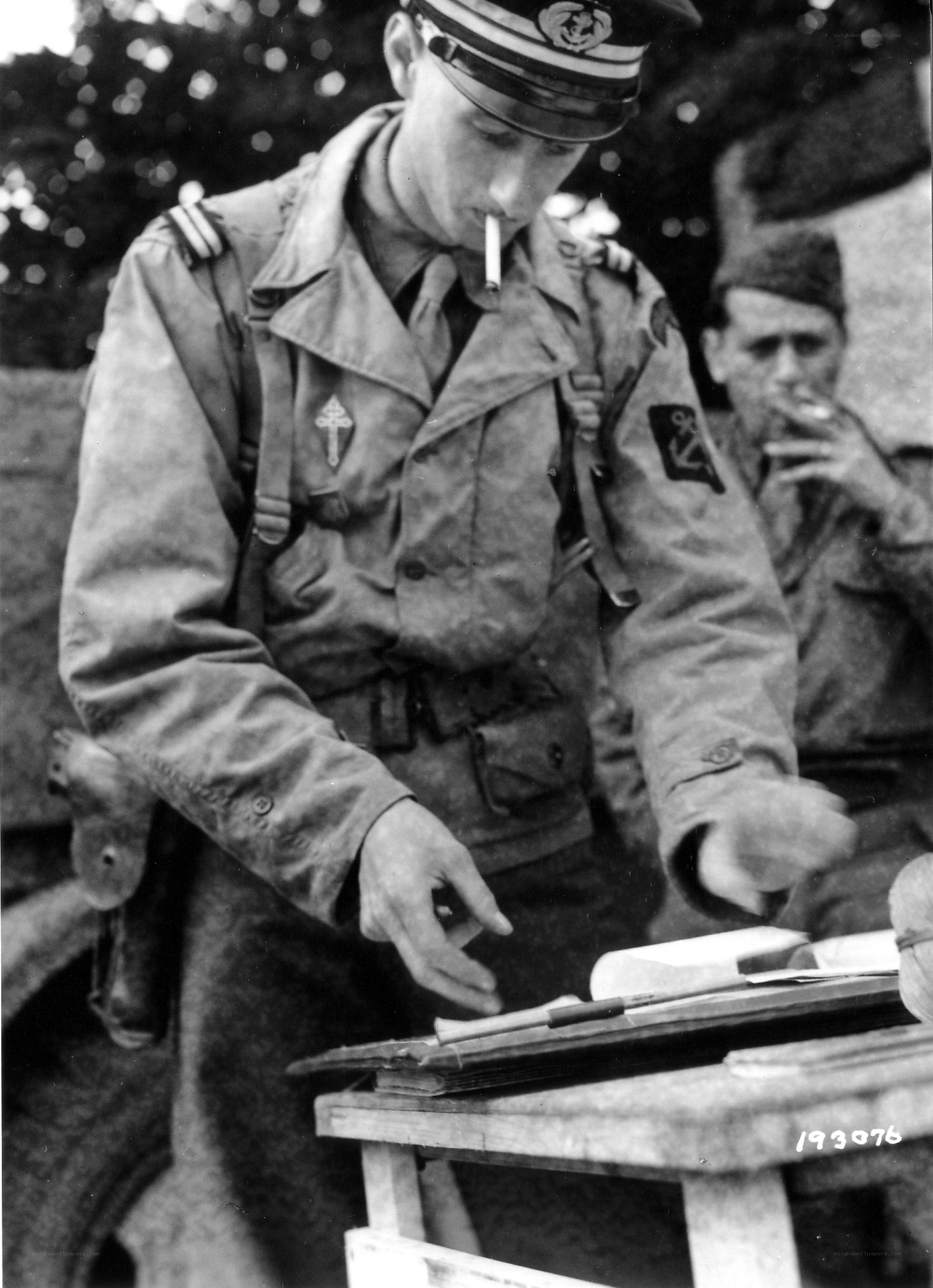 Soldier smoking at a desk