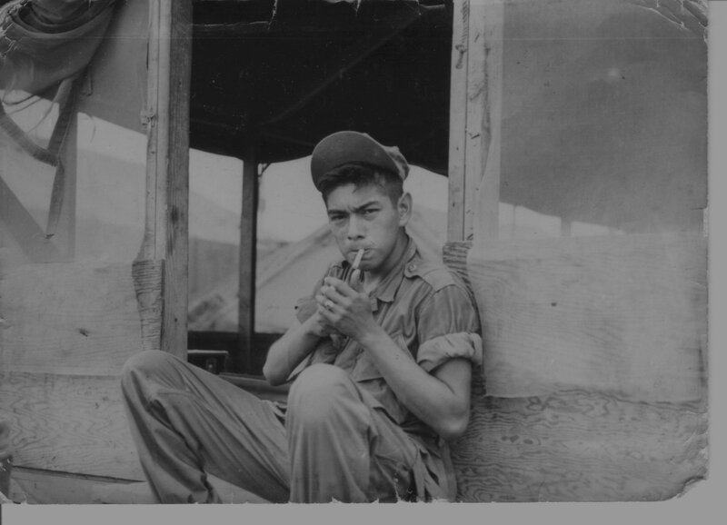 Soldier smoking in tent