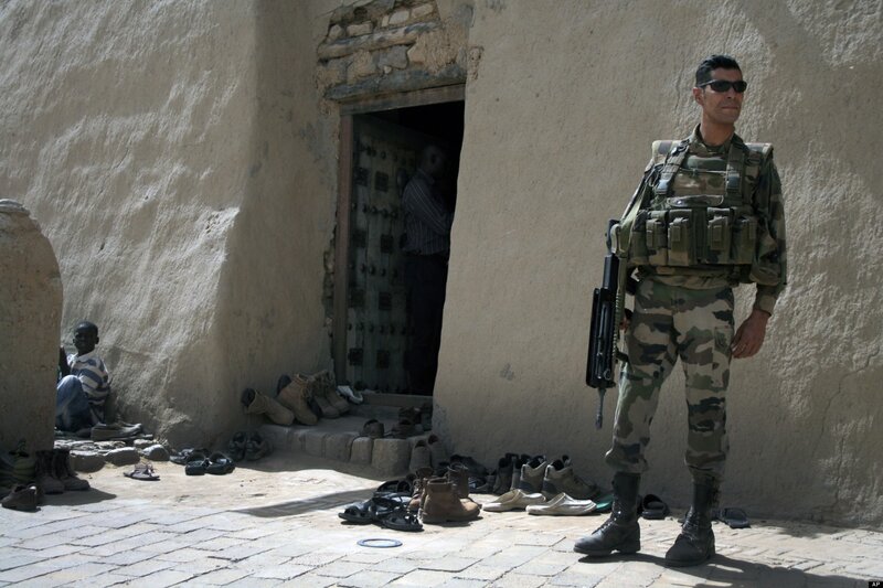 Soldier standing guard outside building