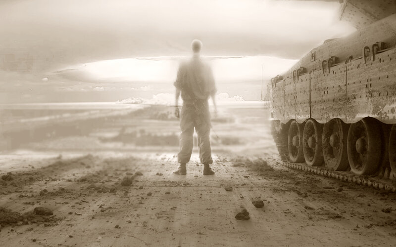 Soldier stands before tank