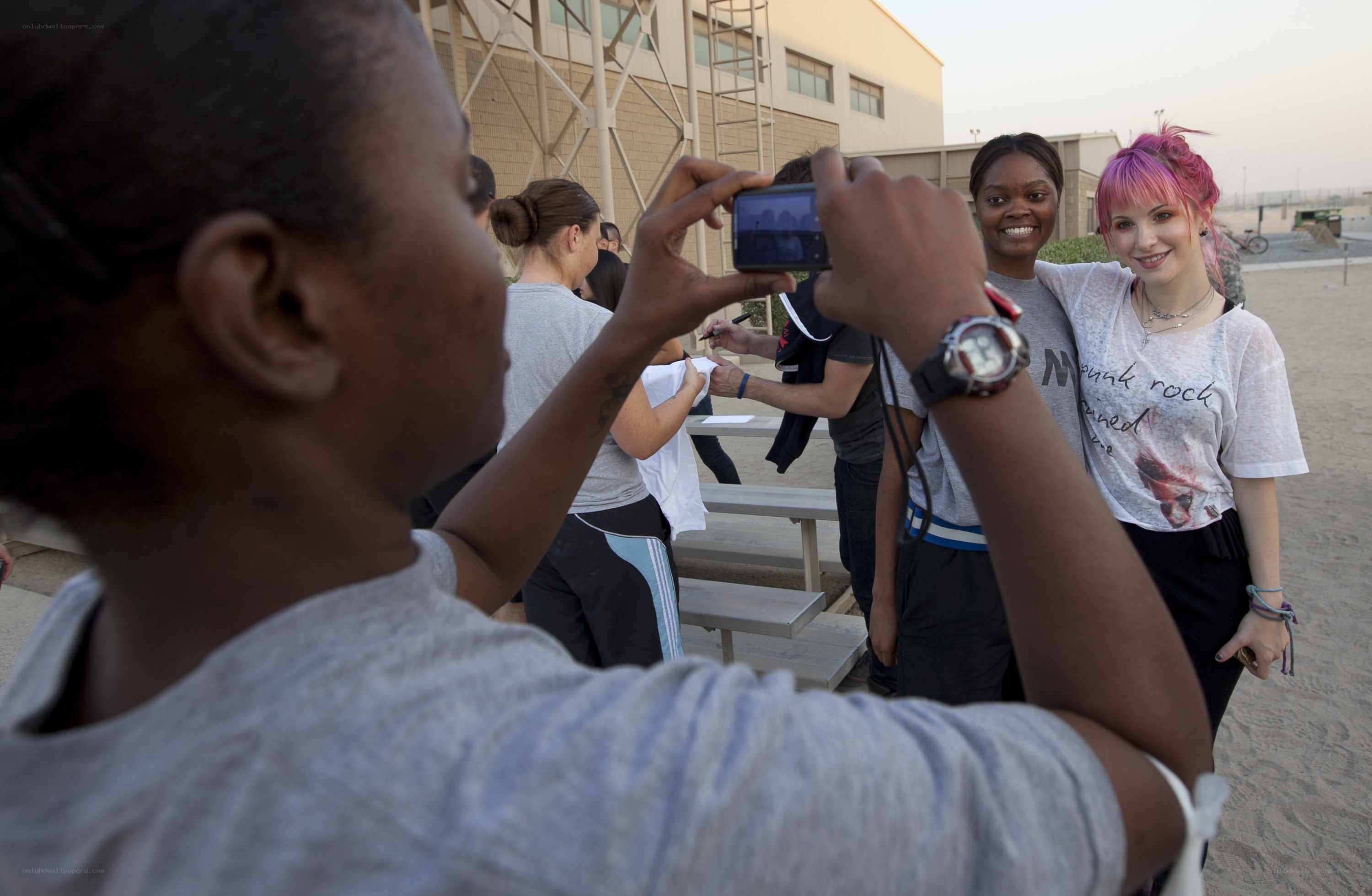 Soldier taking photo with fans