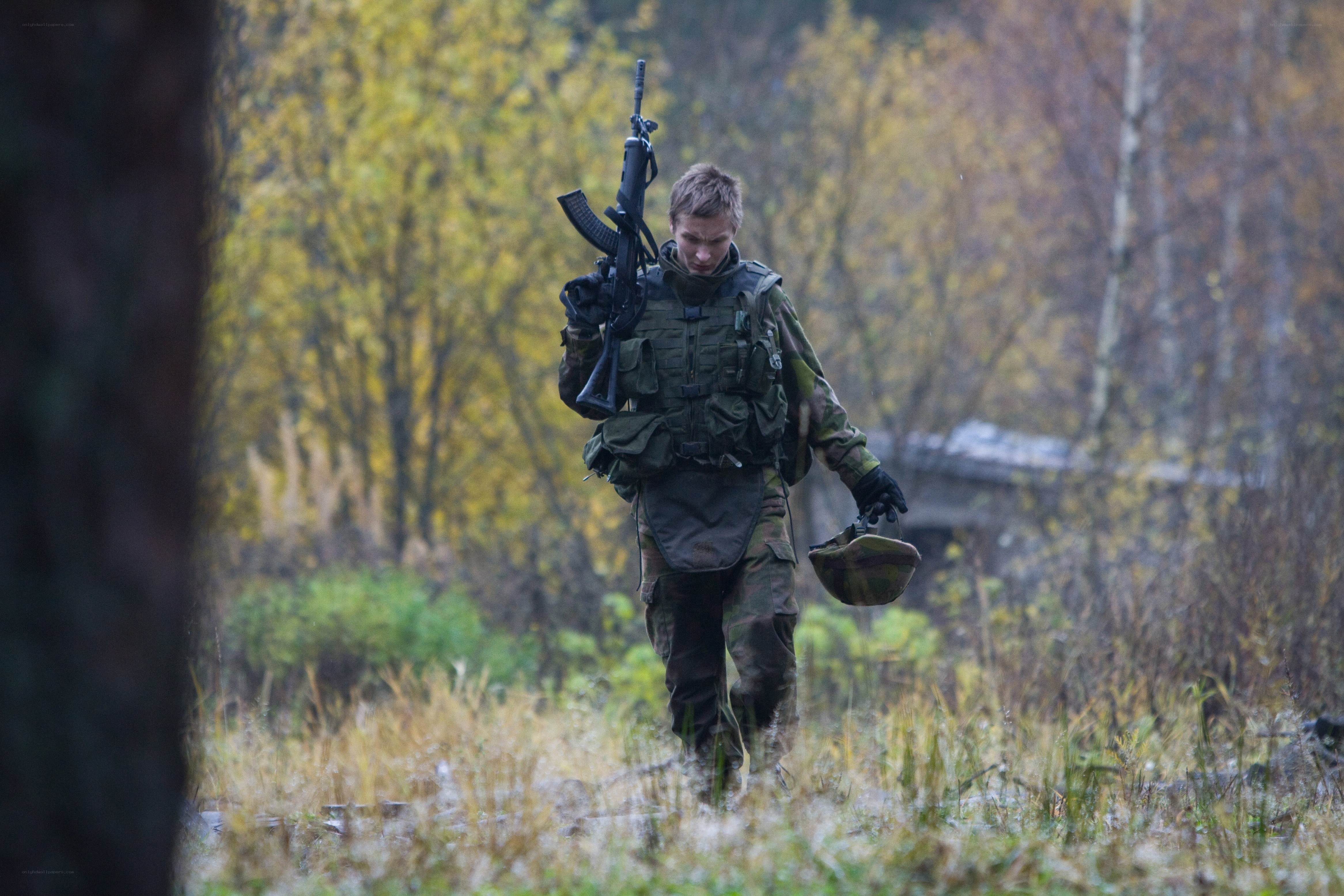 Soldier walking through forest