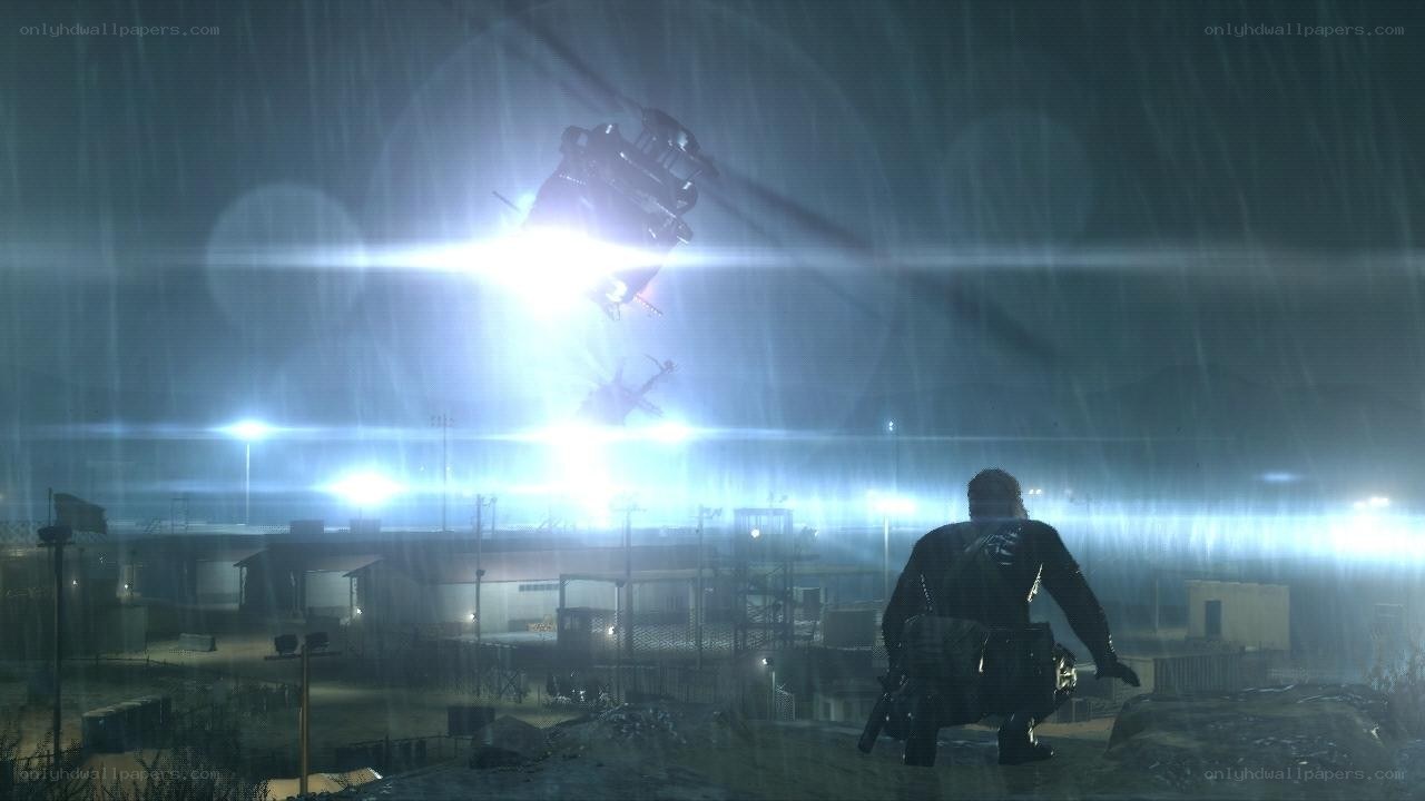 soldier watches helicopter in rain