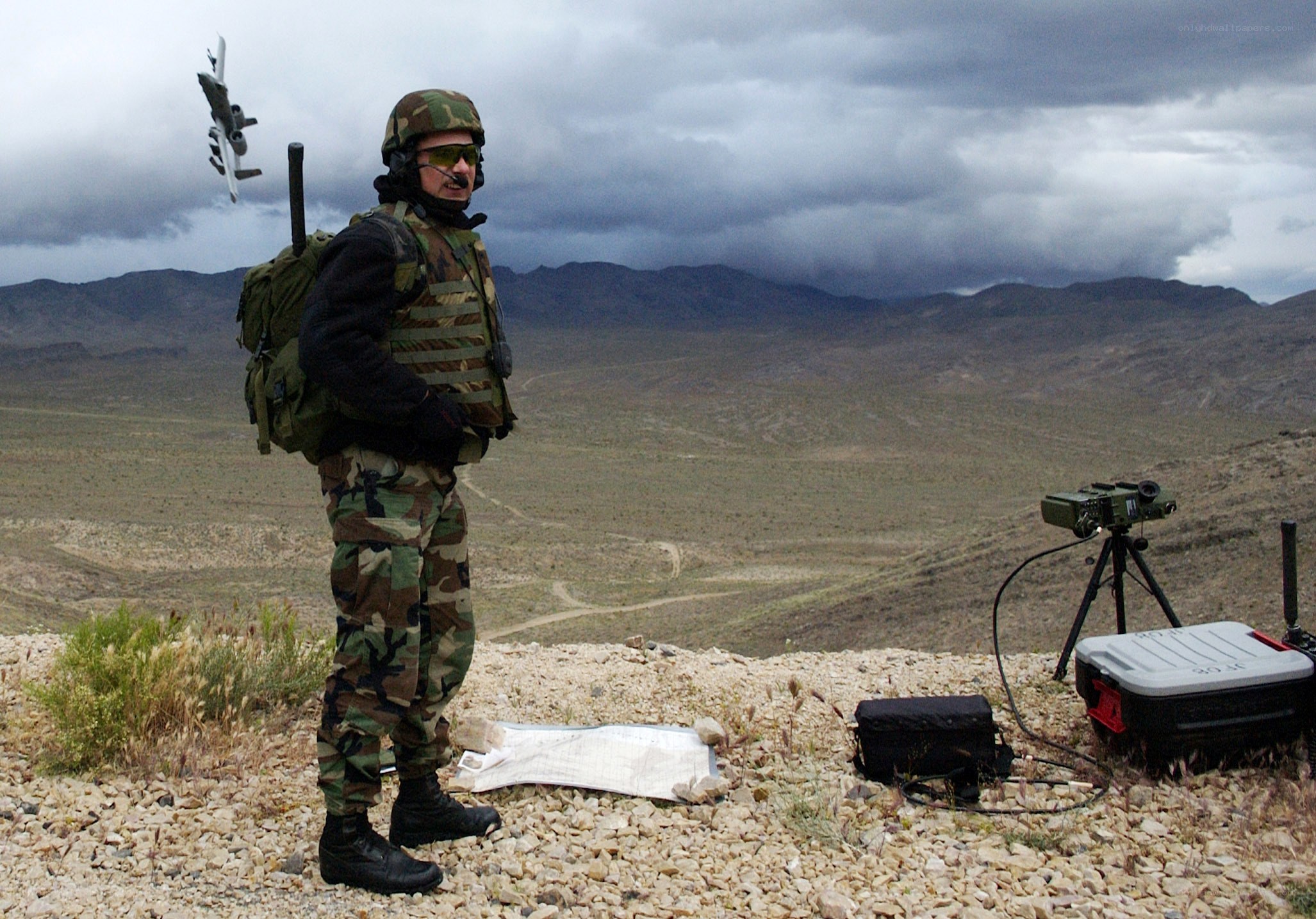 Soldier with aircraft in background