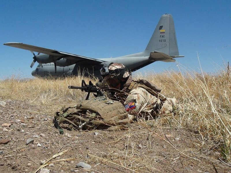 Soldier with aircraft in background