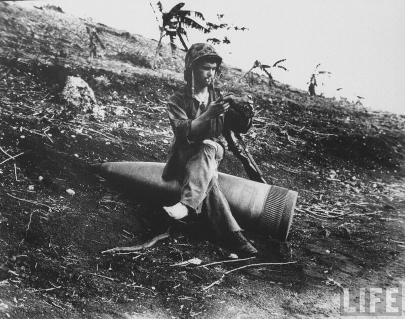 Soldier with artillery shell