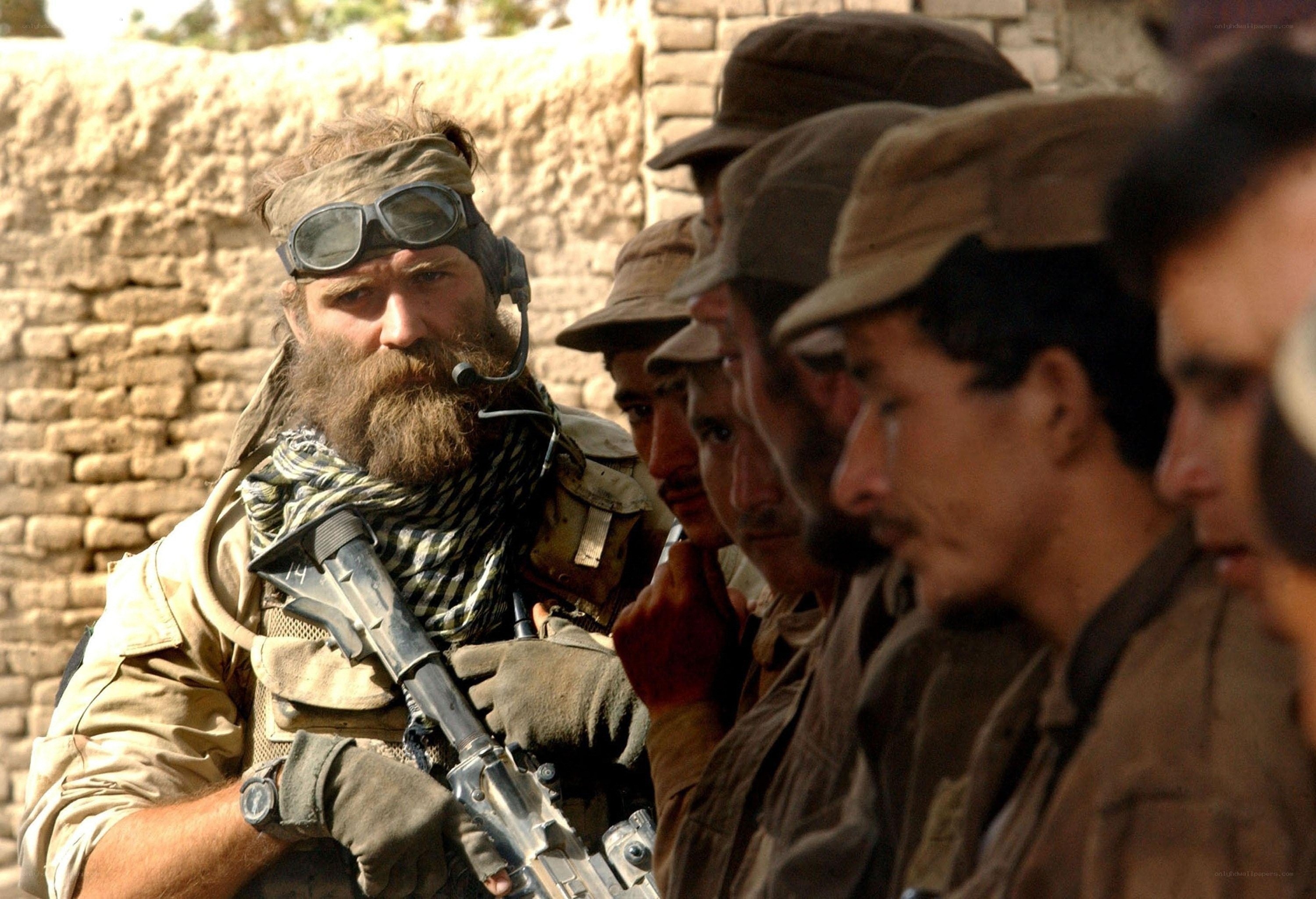 Soldier with beard and rifle