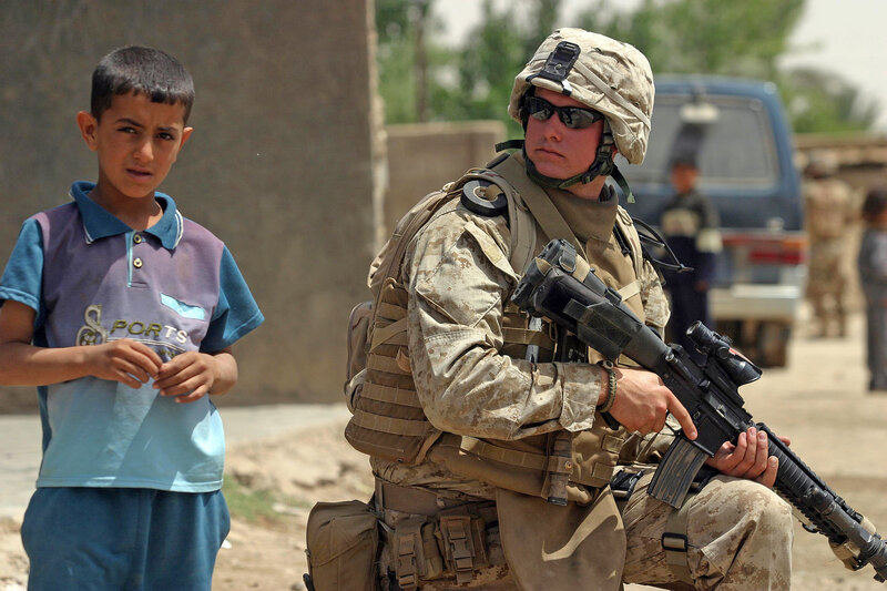 Soldier with child in conflict zone