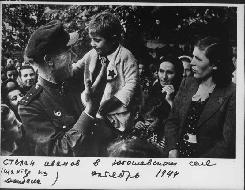Soldier with child in village