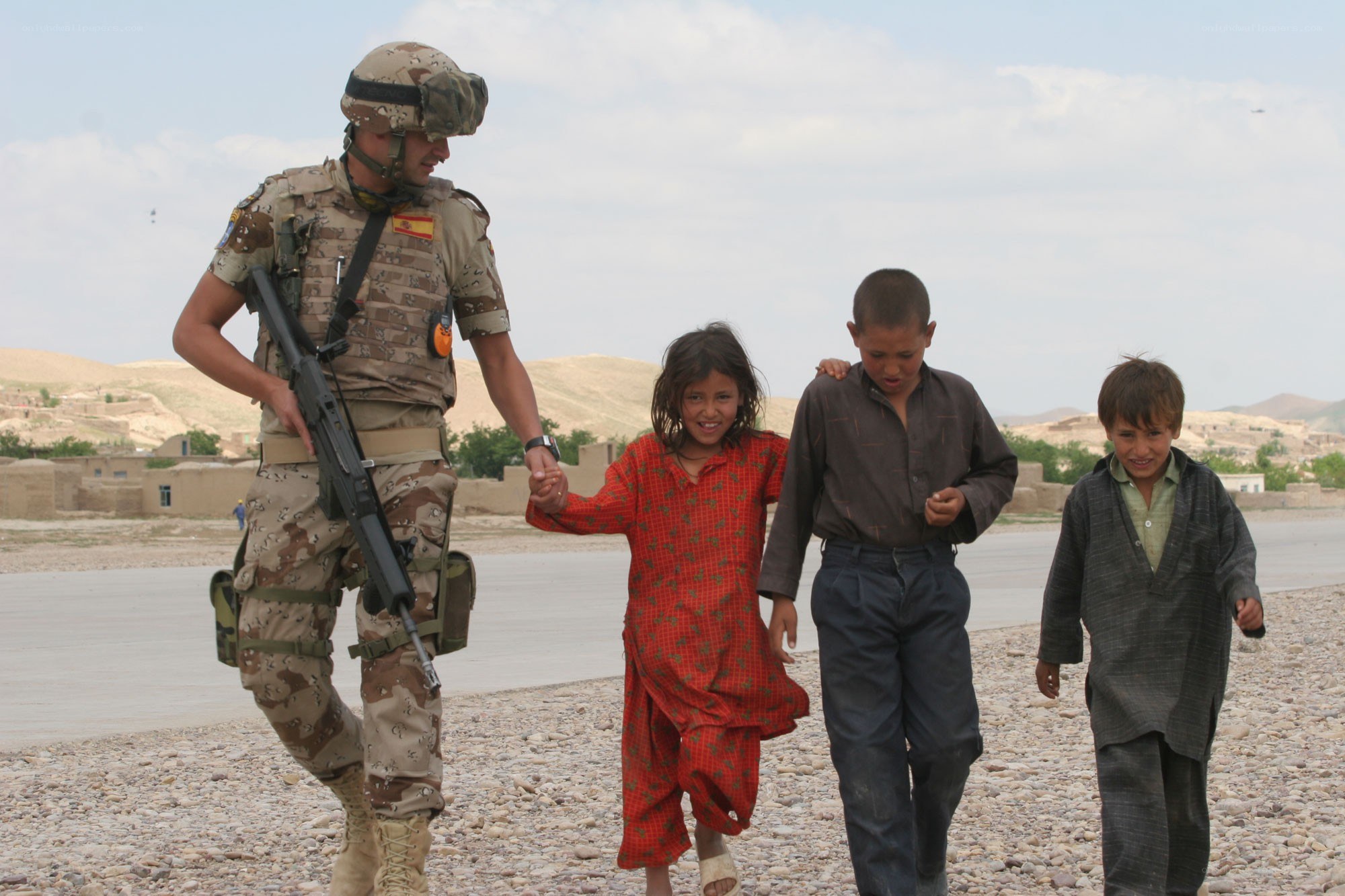 Soldier with children in desert