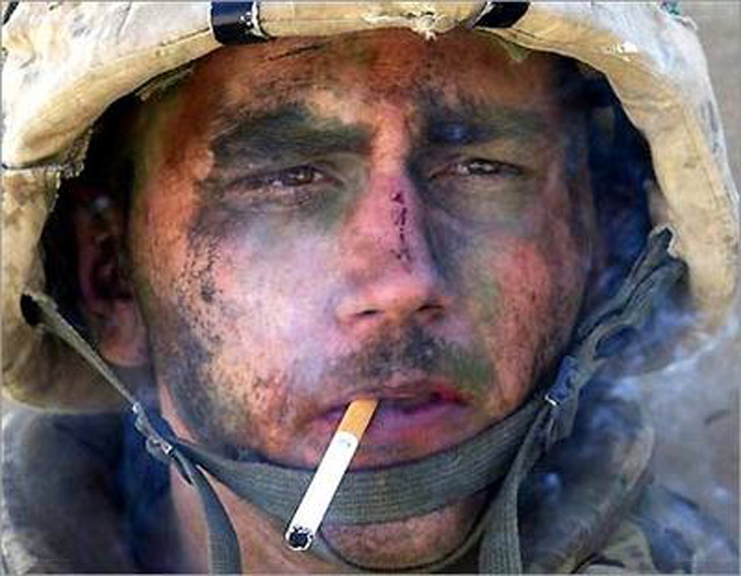 soldier with cigarette in war zone