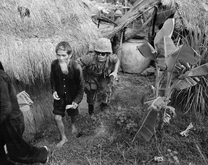 Soldier with civilian in village