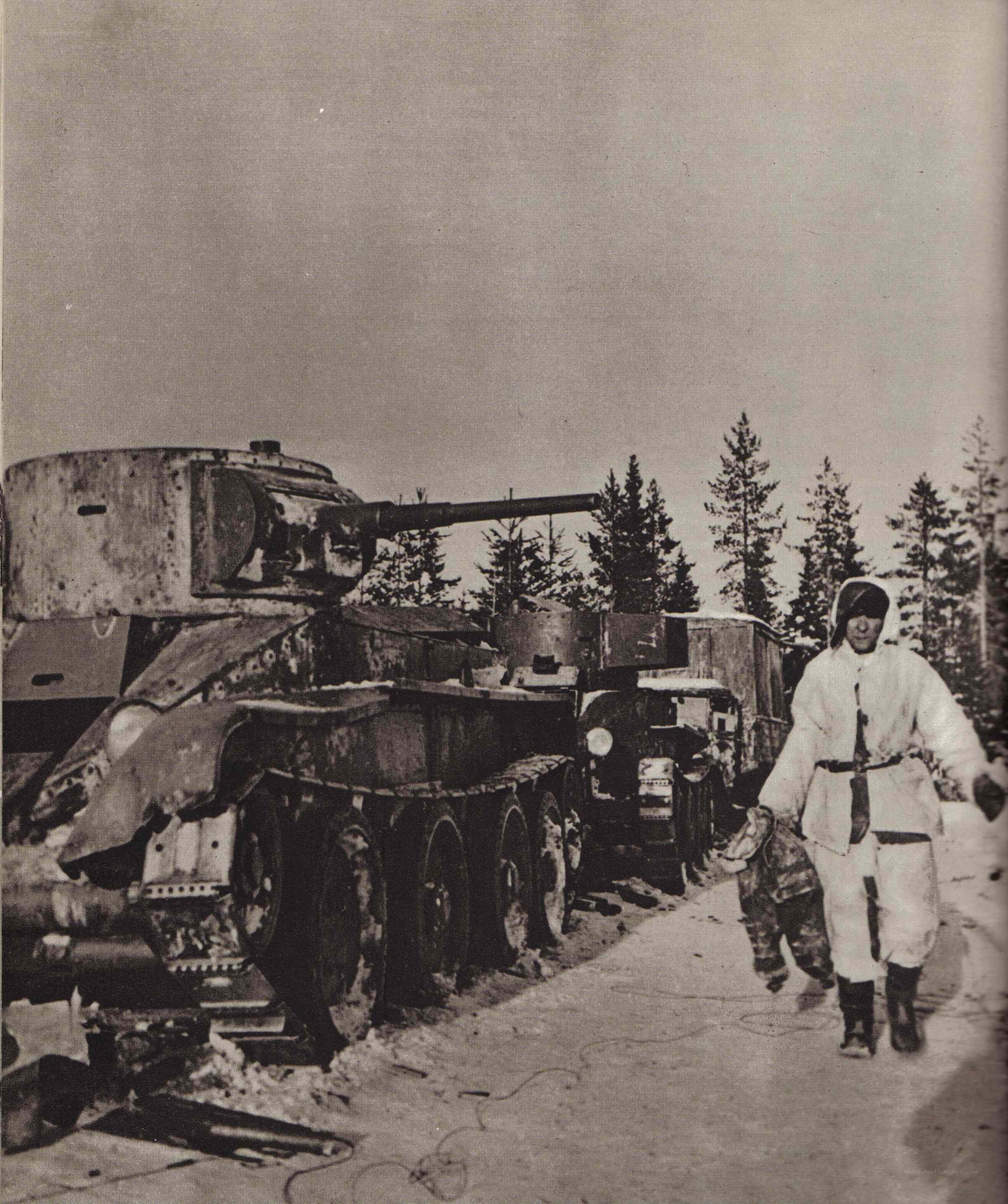 Soldier with damaged tank in winter