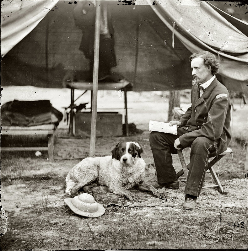Soldier with dog in tent