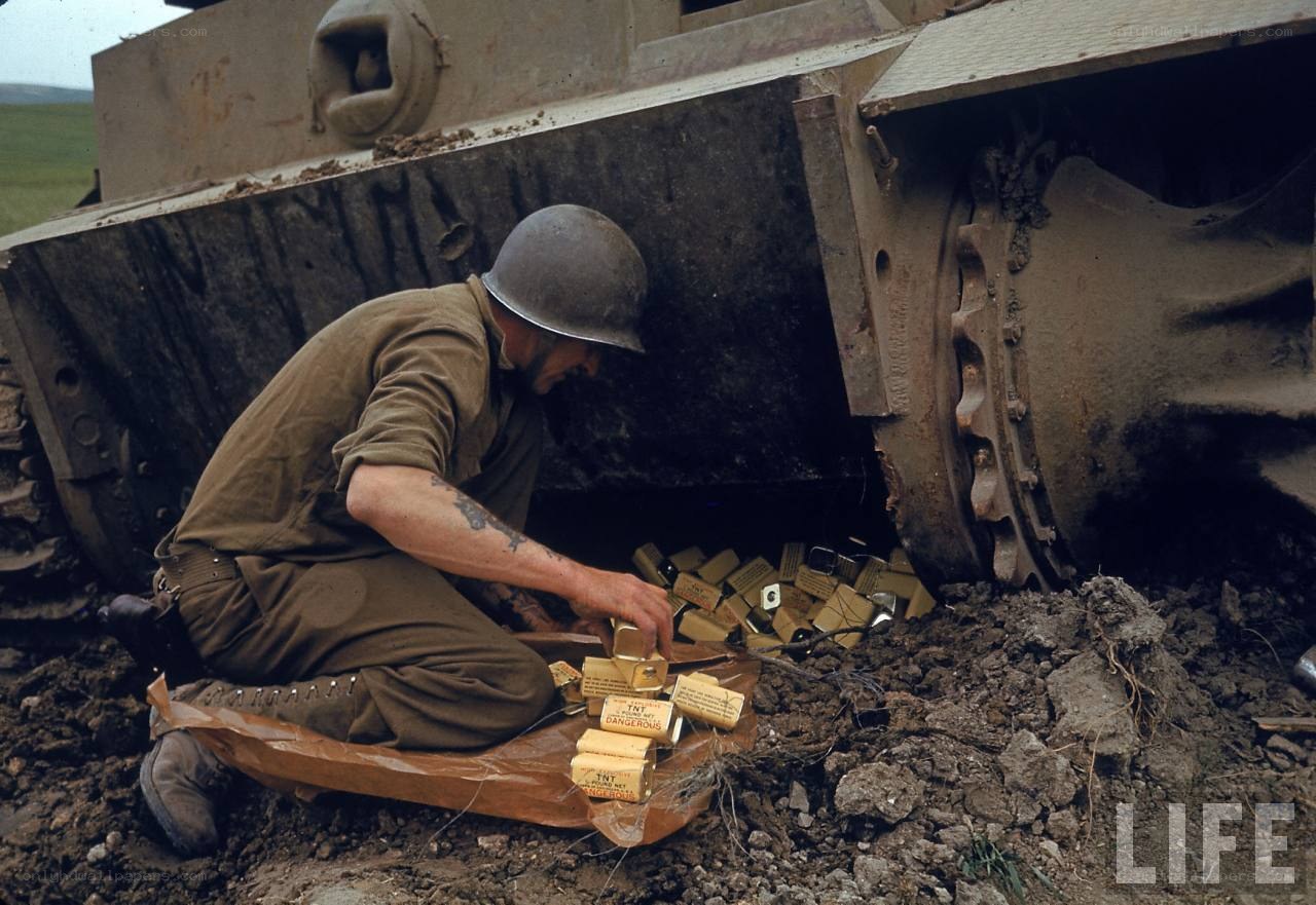 Soldier with explosives near tank