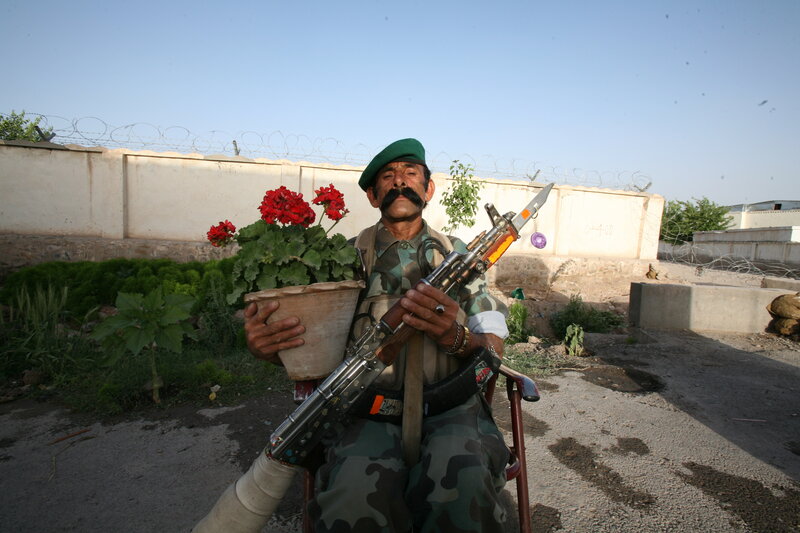 Soldier with flowers and rifle