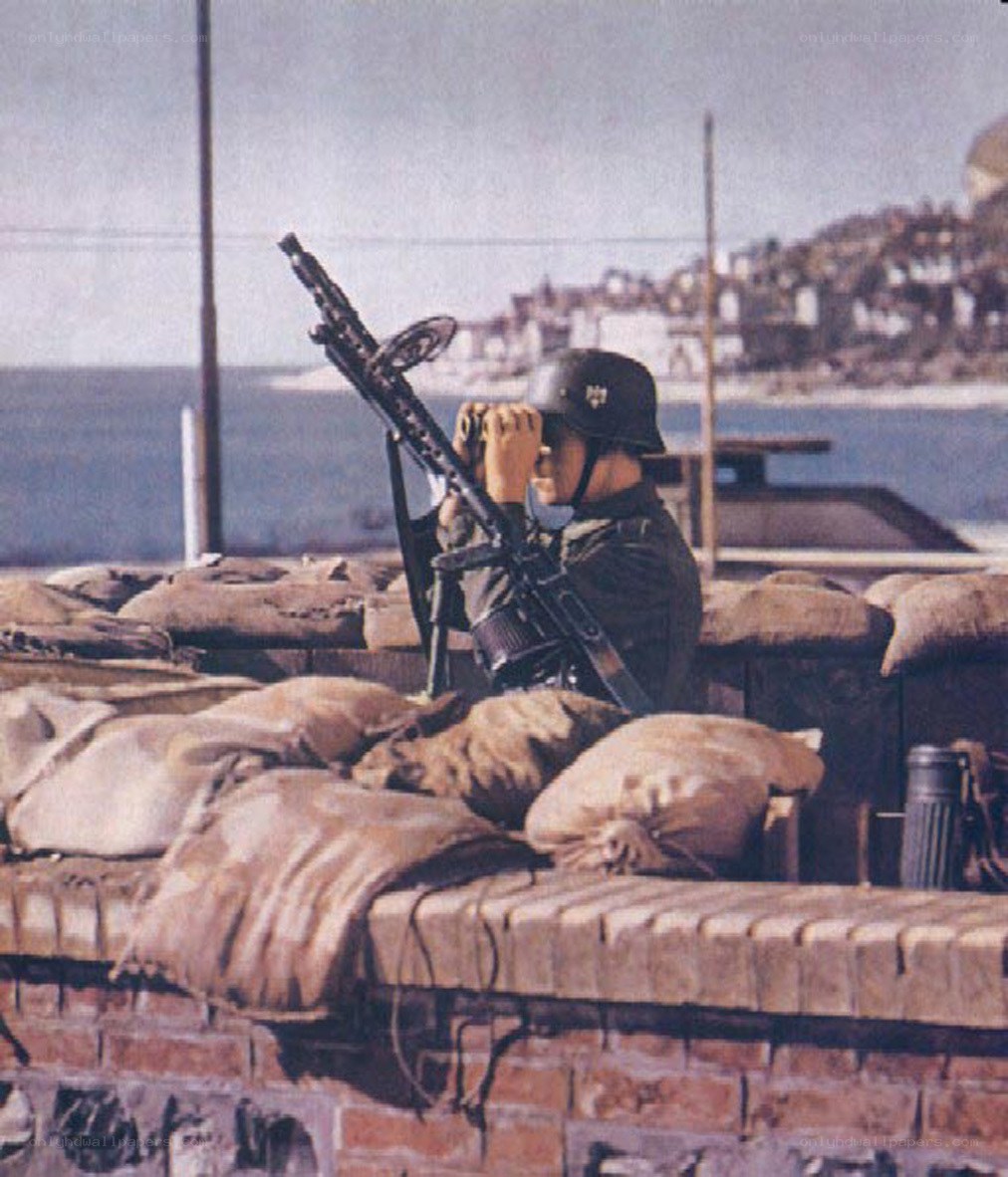 Soldier with machine gun at coastal post