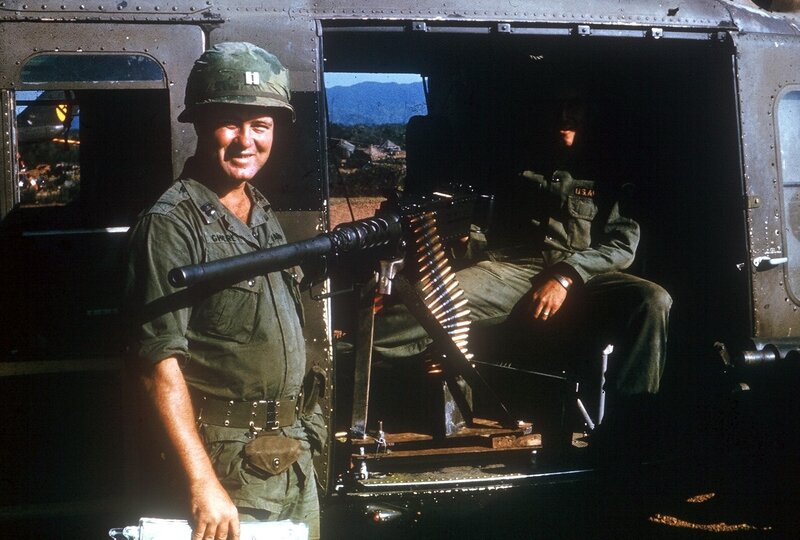 Soldier with machine gun in helicopter