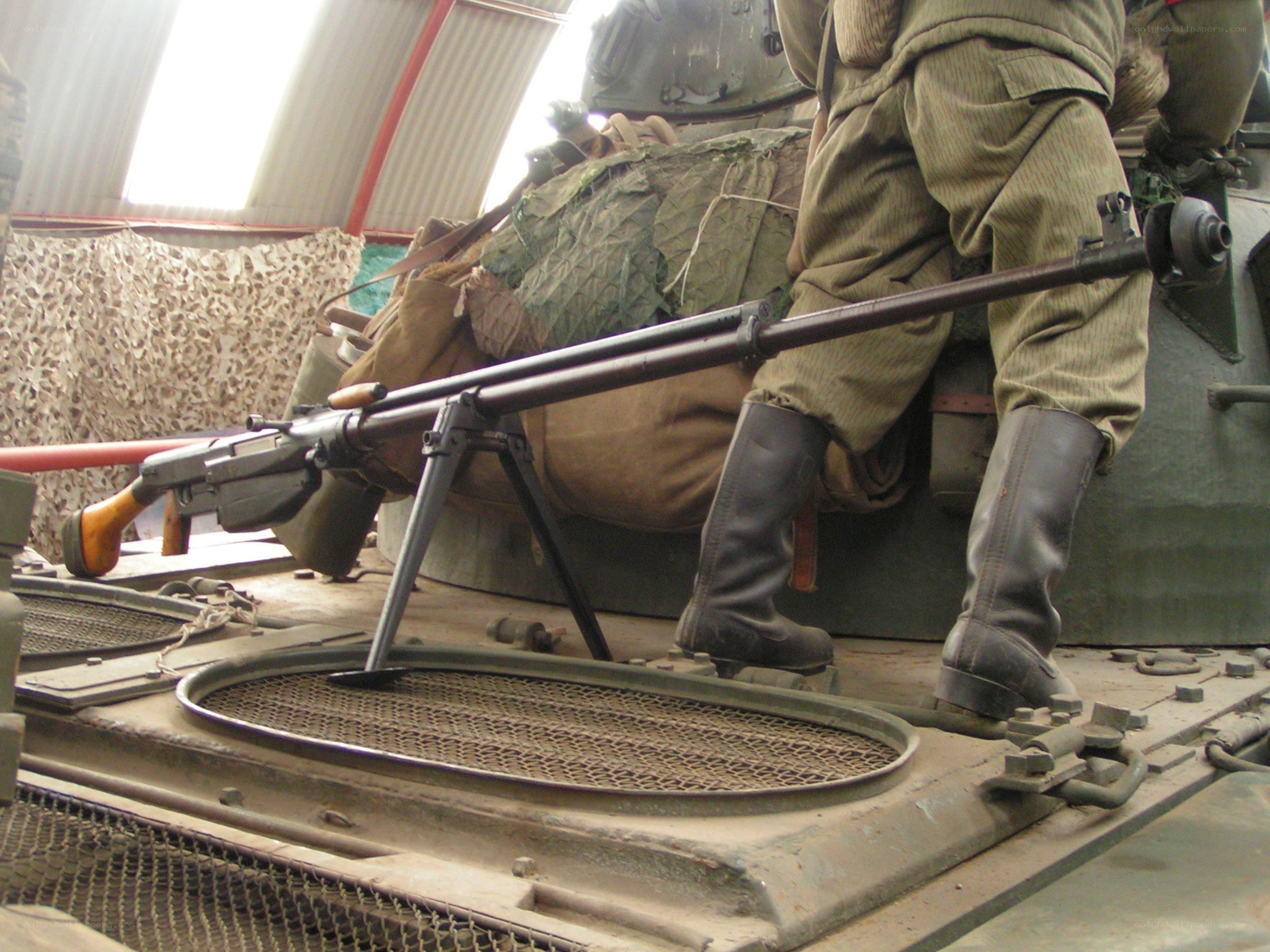 Soldier with machine gun on tank