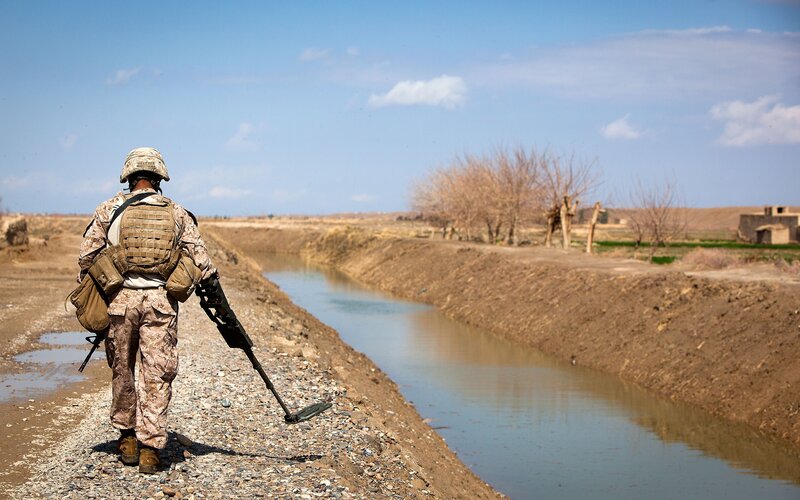 Soldier with metal detector