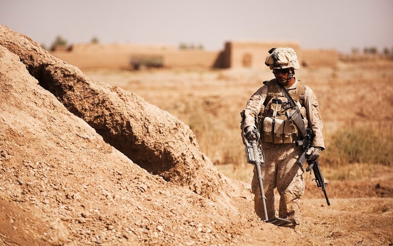 Soldier with Metal Detector — Brown, Serious