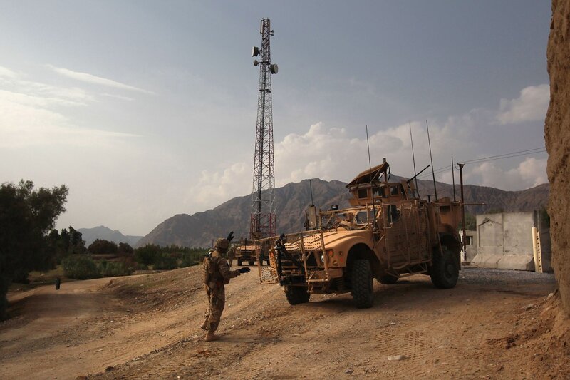 Soldier with military vehicle