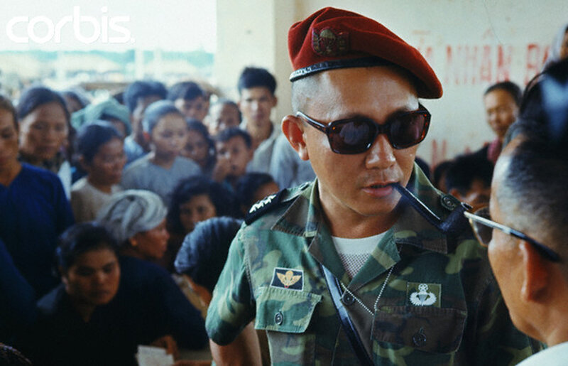 Soldier with pipe in crowd