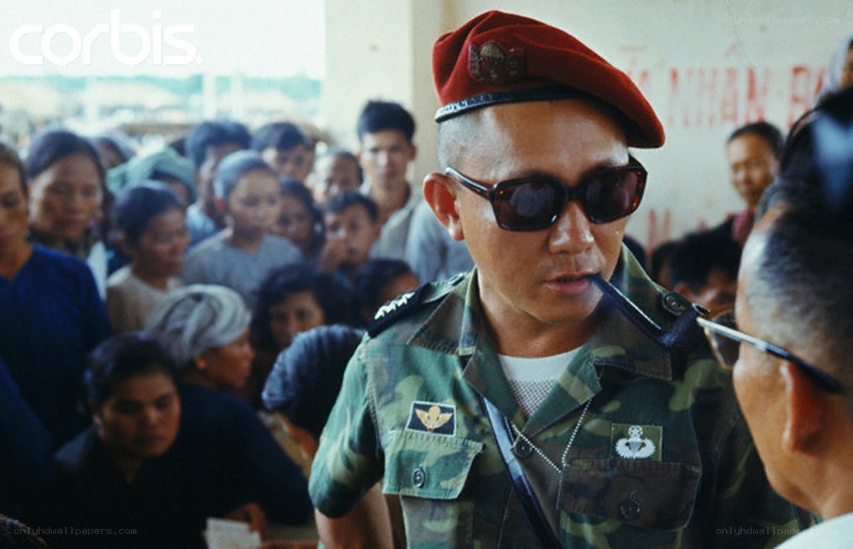 Soldier with pipe in crowd