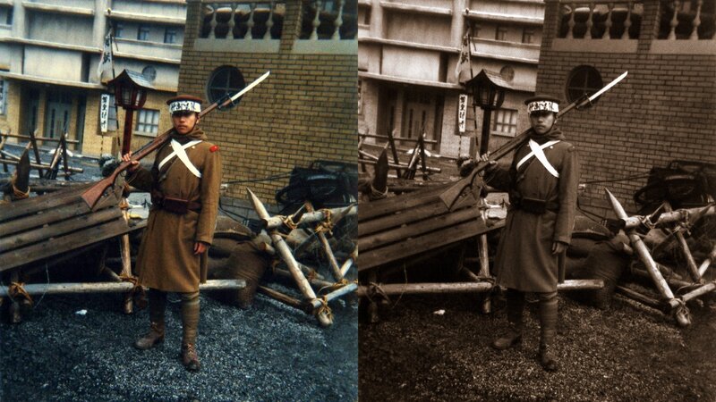 Soldier with rifle at barricade