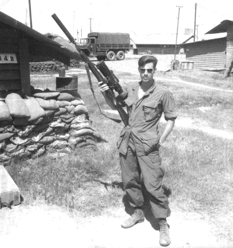Soldier with rifle at military base