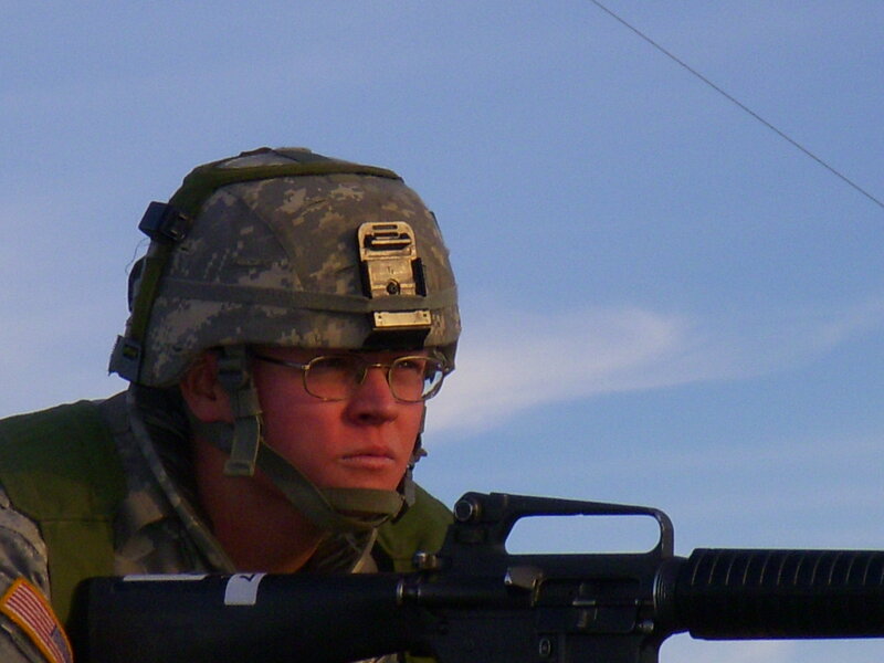 Soldier with rifle in combat gear