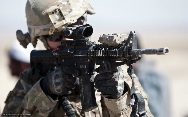 soldier with rifle in desert
