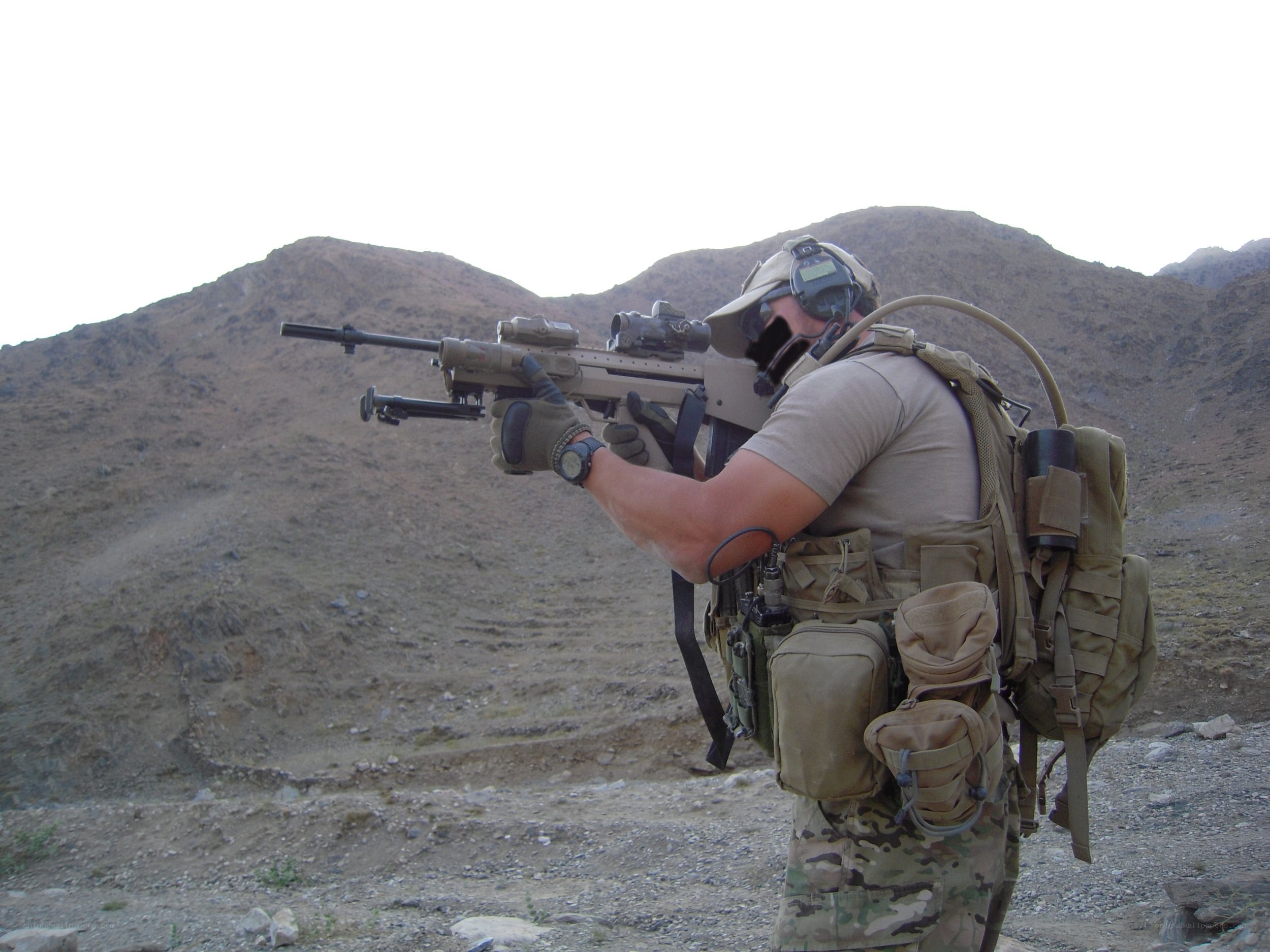 soldier with rifle in desert