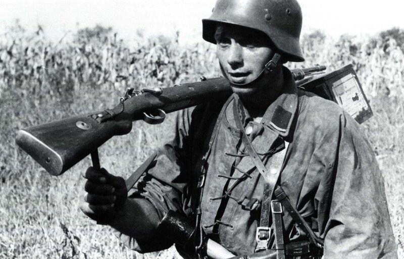 Soldier with rifle in field