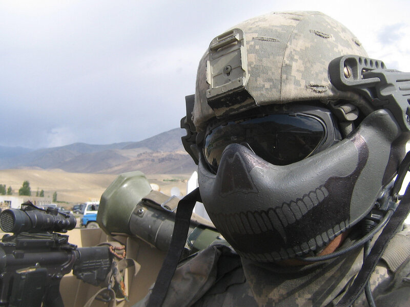 Soldier with skull mask in desert
