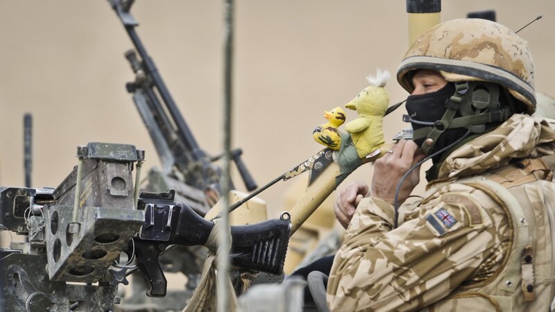 Soldier with toy duck on weapon