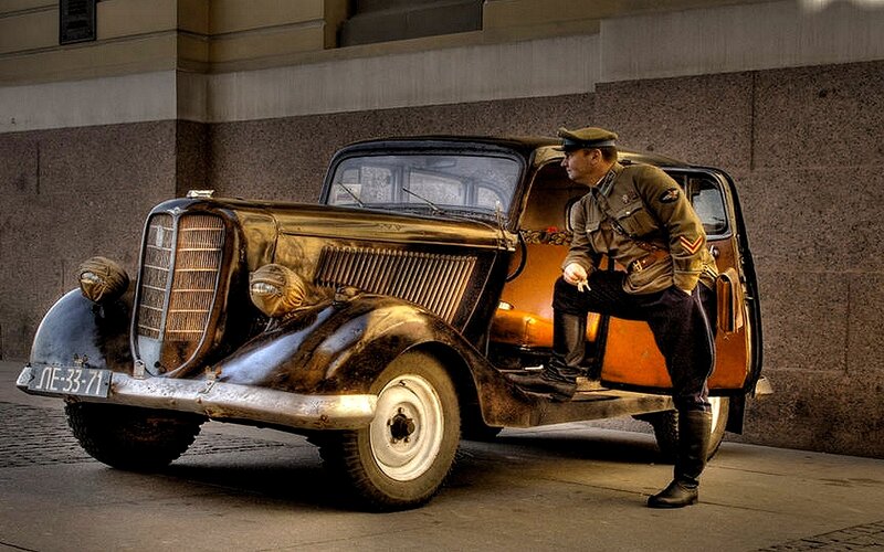 Soldier with vintage car
