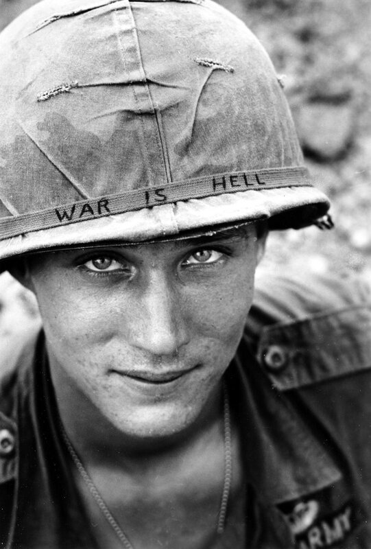 Soldier with 'War Is Hell' helmet