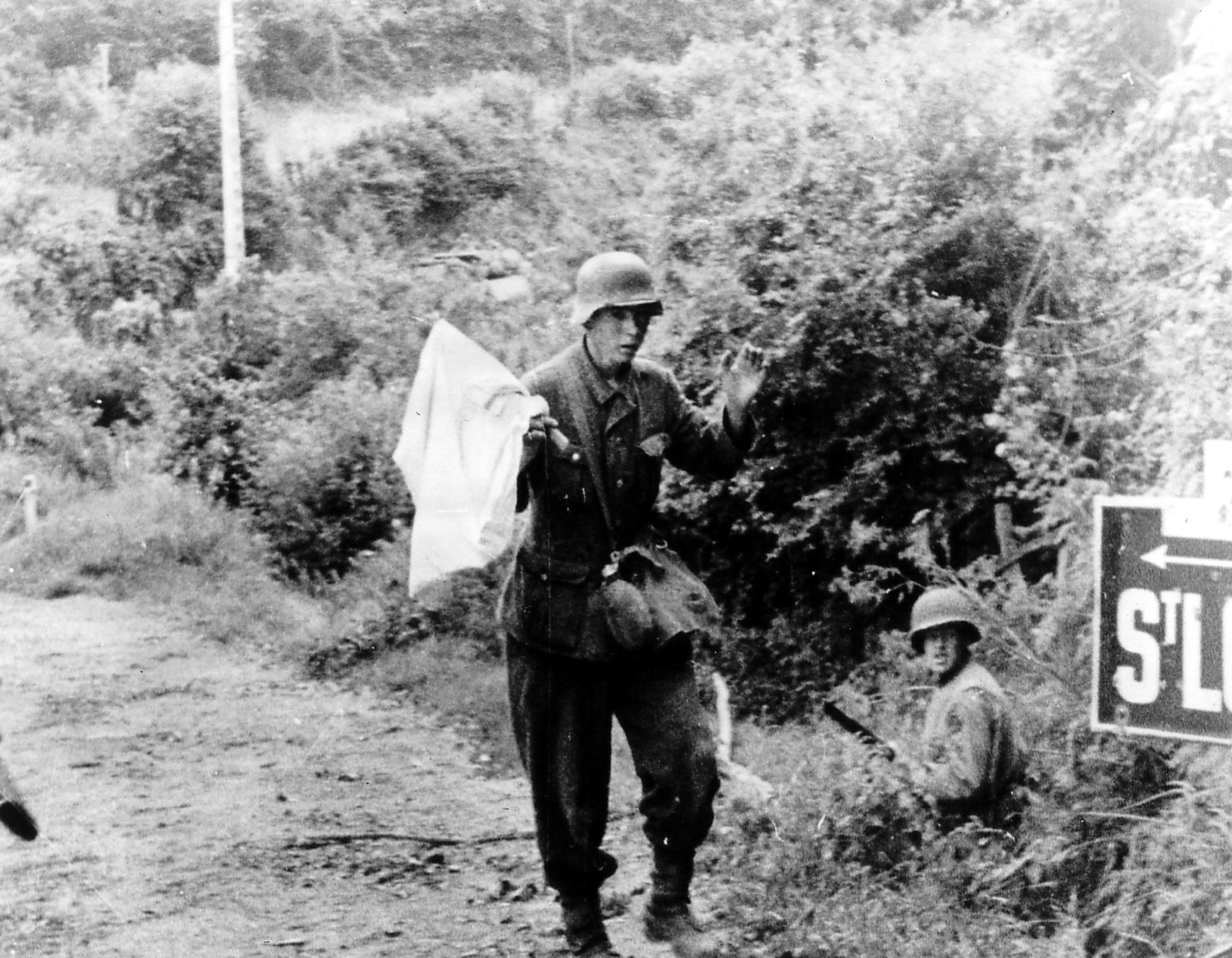 Soldier with white flag on road