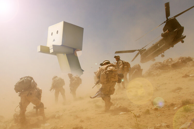 Soldiers and a robot in desert
