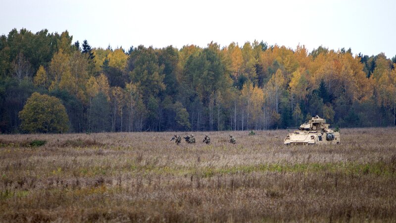 Soldiers and Tank in Field